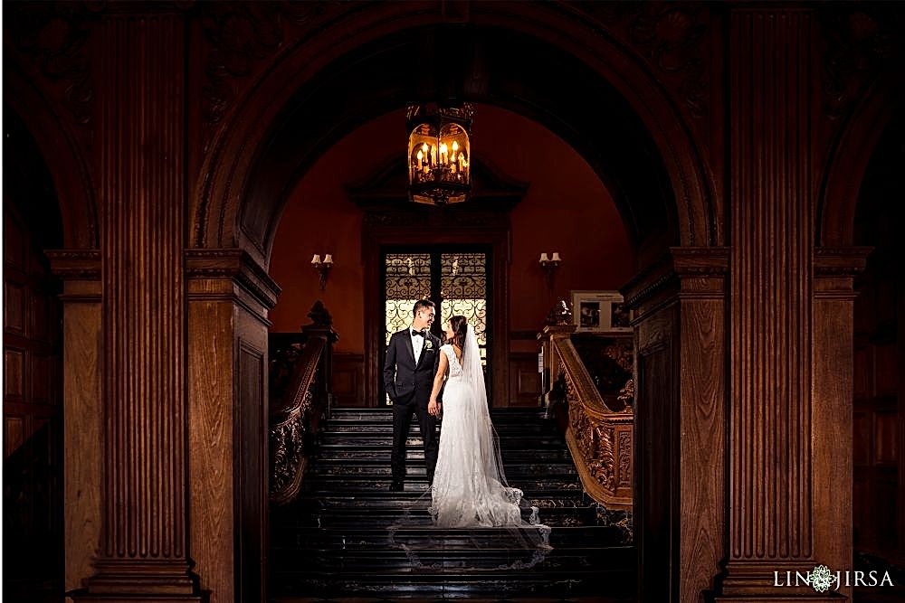 Lin and Jirsa photographing a couple in the Greystone mansion, Beverly Hills, California Lin & Jirsa photographing a couple getting married in the foyer of the wedding venue: Greystone Mansion in Beverly Hills